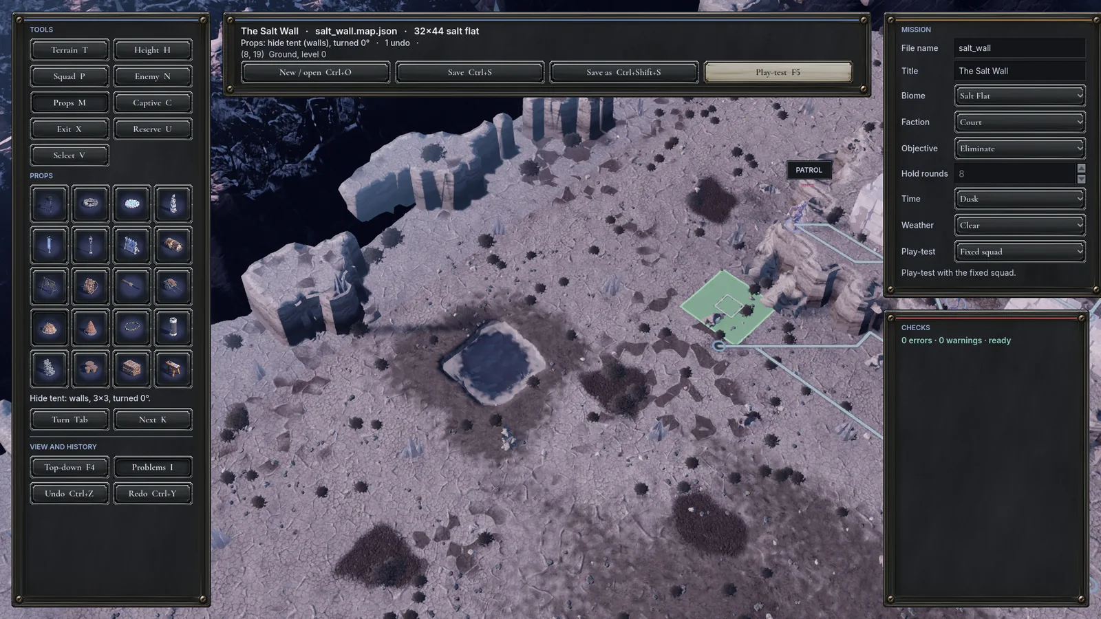 The battle map editor on a salt-flat map: the props palette, a hide tent being placed, the mission panel and a clean checks list